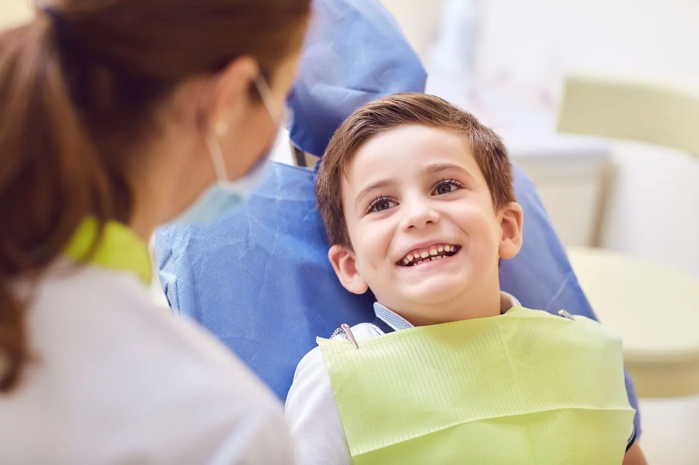A smiling boy in the dental chair